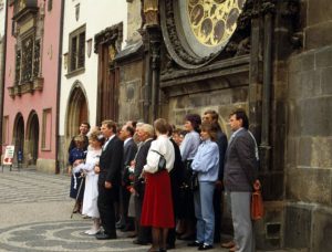czech wedding party under the orloj clock